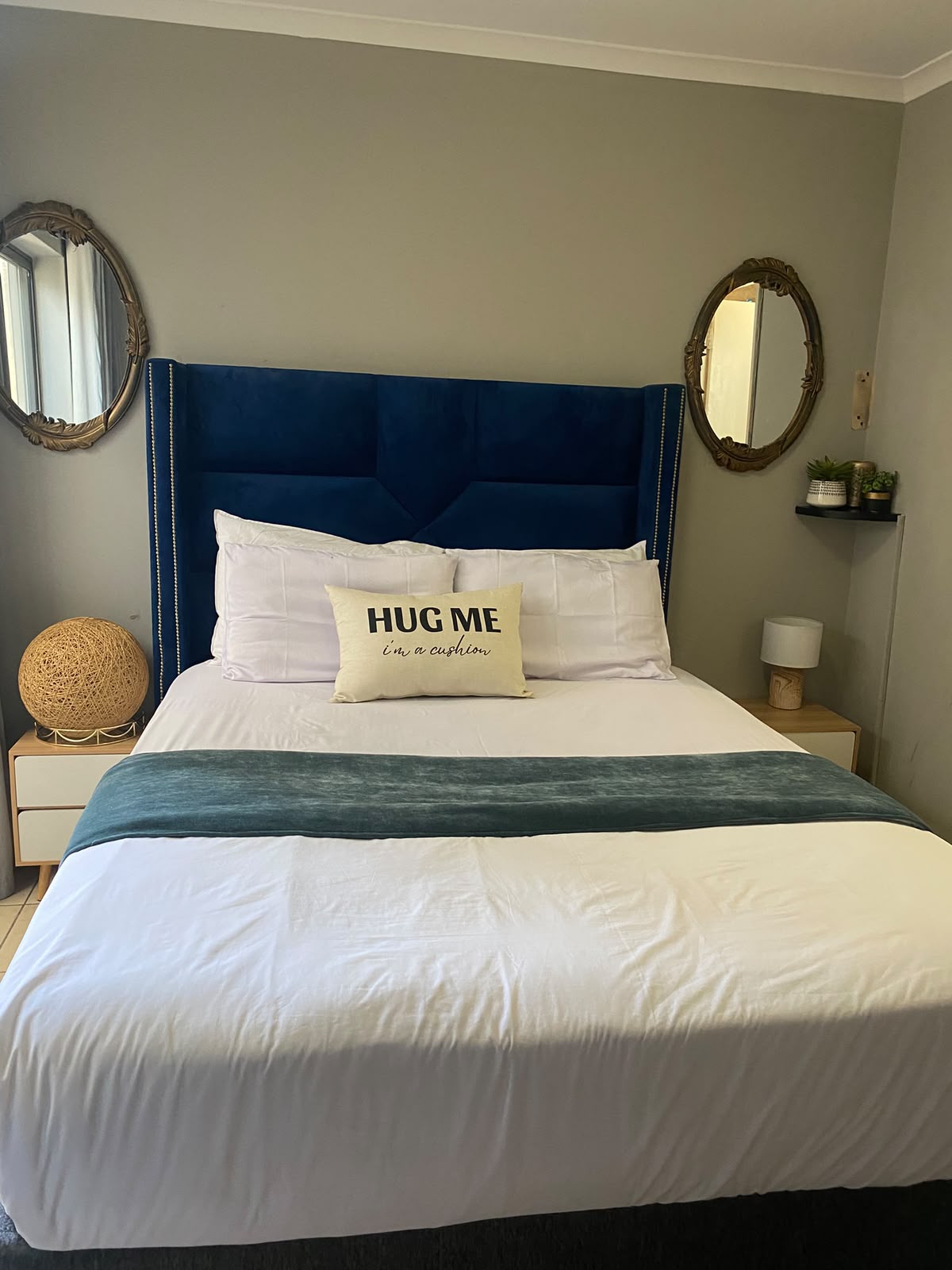 Room 2 at Bahumi Guesthouse 1 with queen bed and navy headboard
